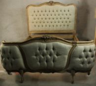 A late 19th/ early 20th century painted Italian hardwood and deep buttoned double bed frame. H.153