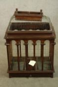 A 20th century teak framed and wirework Victorian style birdcage. H.88 W.60 D.40cm.