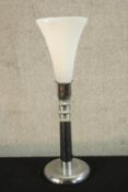 A contemporary chrome table lamp with conical shaped frosted glass light shade. H.58cm.