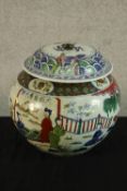 A late 20th century Chinese porcelain jar and cover, decorated with figures in a garden, bearing six