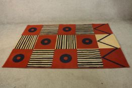 A 20th century abstract woollen rug, allover modernist geometric design. L.195 W.136cm.