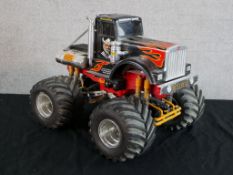 A plastic model of a Monster Truck. H.35 W.39 D.42cm