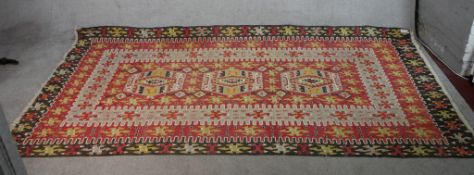 A 20th century Kelim with a geometric pattern. W.160 x L.308cm.