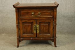 A contemporary elm Chinese style single drawer cabinet with two doors below raised on splayed