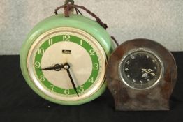Two 1950s electric clocks. Largest D.50cm