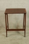 An early 20th century mahogany occassional table raised on splayed supports. H.63 W.50 D.36cm.
