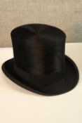 A boxed early 20th century John Hutton & Sons of Newcastle upon Tyne gentlemens black silk top