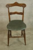 A 19th century mahogany framed bar back single chair with stuffover seat, raised on turned splayed