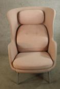 A mid 20th century Pink winged back armchair raised on splayed metal legs. H.112 x W.80 cm.