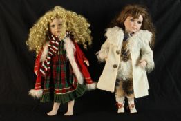 Two contemporary porcelain headed collector's clothed dolls with articulated limbs. H.58cm. (