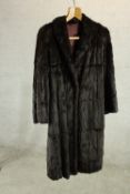 A ladies black fur full length coat. L.80cm.
