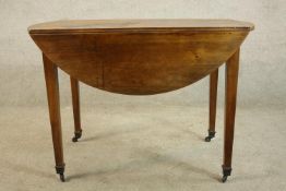 A 19th century French drop flap table with single drawer, raised on square tapering supports