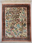 A Persian/Iranian silk Qum (Qom) rug, the central ivory field with tree of life and bird