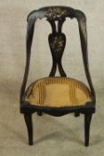 A 19th century mother of pearl inlaid lacquer spoonback chair with cane seat raised on cabriole
