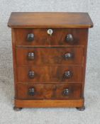 A 19th century mahogany jewellery cabinet with lockable hinged lid above three drawers each with