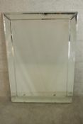 A contemporary chrome plate framed mirror. H.106 W.75cm.