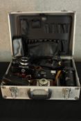 A collection of cameras including the Topcon Uni 35mm SLR. Also, the Ilford Sporti and, Olympus