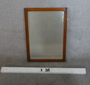 A mid 20th century teak framed rectangular wall mirror. H.68 W.47cm