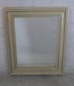 A 20th grey painted oak framed wall hanging mirror. H.87 W.68cm
