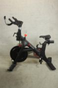 A Peleton exercise bike. H.122cm.