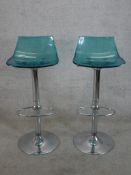 A pair of late 20th century blue moulded and chrome plated adjustable kitchen stools.