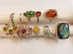 A collection of ten silver and gold plated silver dress rings some set with gemstones, including