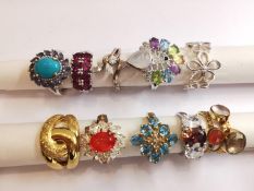 A collection of ten silver and gold plated silver dress rings set with various gemstones,