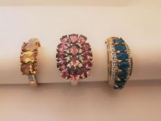 Three 20th century 9 carat white gold gem-set rings: a blue stone and diamond dress ring, diamond