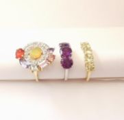 Three 20th century 10 carat gold gem-set rings: an abstract design ring set with Ethiopian fire