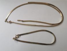 A 9ct yellow gold flat S-link chain and matching bracelet with secure C-sprung clasps. Stamped