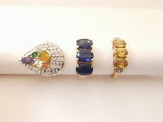 Three 20th century 10 carat gold gem-set rings: a three stone sapphire and diamond ring, a yellow