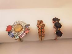 Three 20th century 10 carat white gold gem-set rings: a Citrine floral design dress ring, an