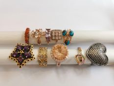 A collection of ten silver and gold plated silver dress rings some set with gemstones, including