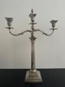 A weighted large three branch sterling silver candelabra with classical form, scrolling foliate arms