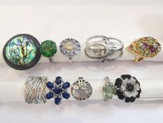 A collection of ten silver and gold plated silver dress rings some set with gemstones, including