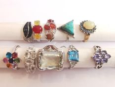 A collection of ten silver and gold plated silver dress rings some set with gemstones, including
