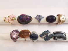 A collection of ten silver and gold plated silver dress rings some set with gemstones, including