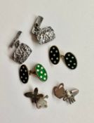 Three pairs of silver chain-link cufflinks. A pair gilded silver green and and white polka dot