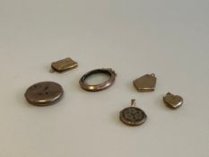A collection of six 9 carat gold back and front lockets of various shapes and some with engraving.