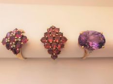 Three 20th century 9 carat and 10 carat yellow gold gem-set rings: an amethyst dress ring set to