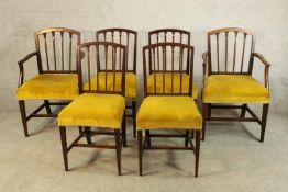 A set of six 19th century mahogany framed shaped spindle back dining chairs raised on tapering