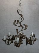 A late 19th century brass six branch electroliier, with applied brass Rococo leaf decoration. H.90