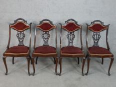 A set of four late 19th/early 20th century mahogany show framed and pierced splatback dining
