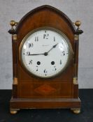 An Edwardian Harrods inlaid mahogany Gothic arch mantle clock, the white dial with black painted