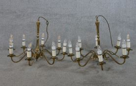 A matched pair of 20th century brass eight branch hanging electroliers. H.50 W.70 D.70cm