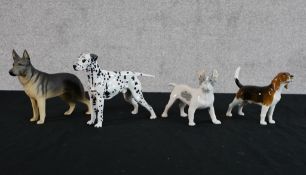 A Royal Doulton porcelain black and white standing dog, HN9113, together with a Beswick bisque