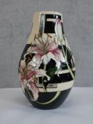A Moorcroft Stargazer Lilly. Designed by Vicky Lovatt. Vase with a part mirrored finish. Signed '
