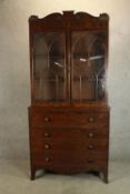 An early Victorian mahogany W. Priest of Blackfriars glazed secretaire bookcase, the upper section