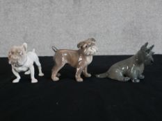 A Royal Copenhagen porcelain seated dog with painted marks to base, together with two other