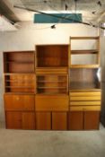 An extensive mid twentieth century modular storage, shelving and cupboard unit. Complete. H.120 x